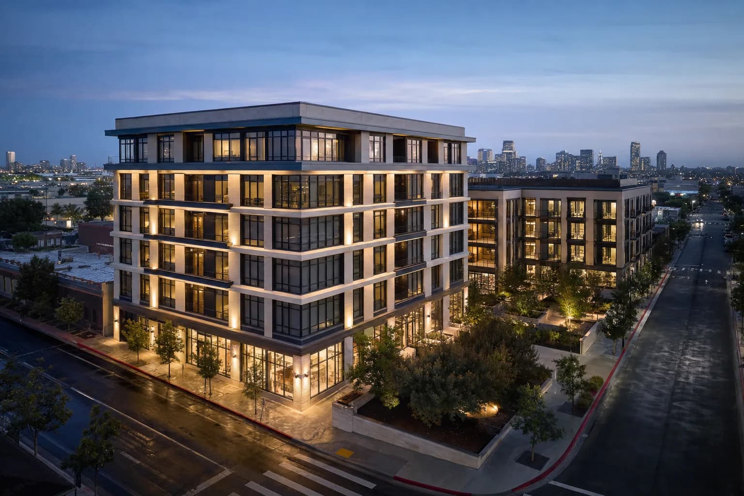 A completed mixed-use development at dusk, the built outcome of the project lifecycle